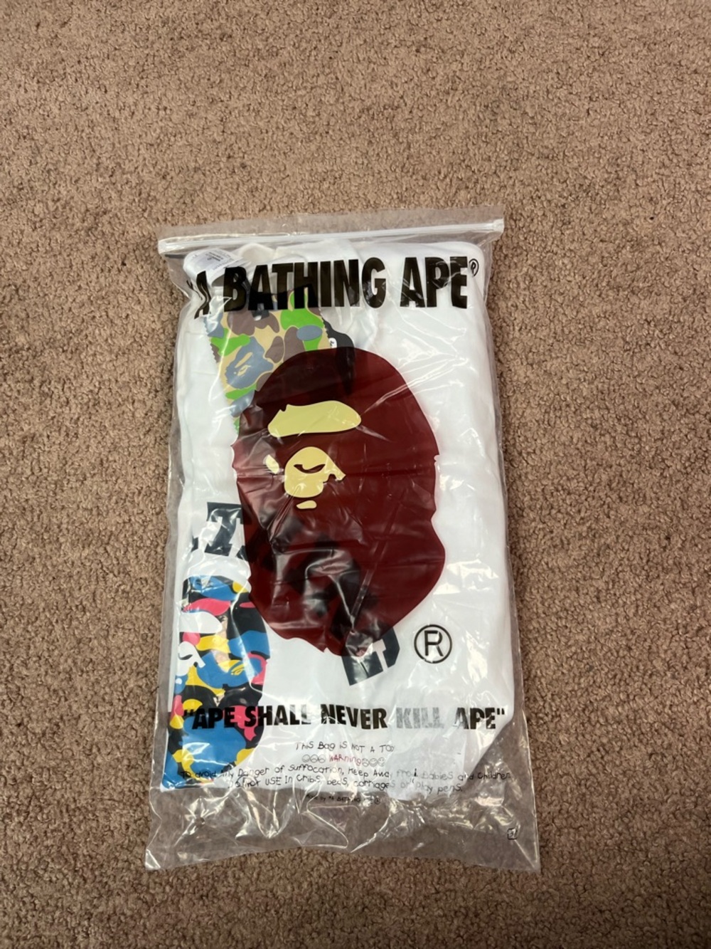 A Bathing Ape (BAPE) White Short Sleeve Tee with Iconic Ape Head